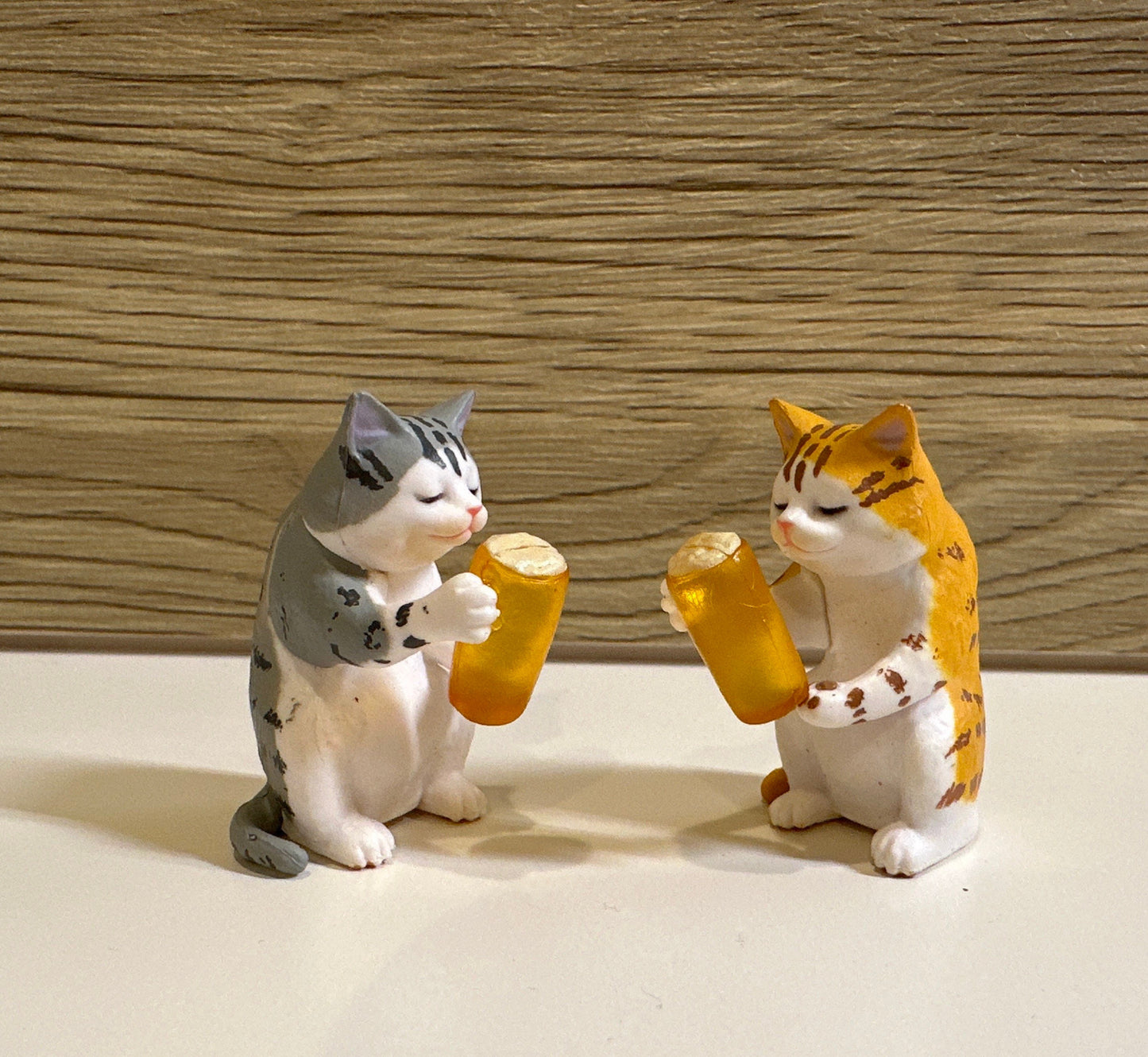 Drunk cat figurines