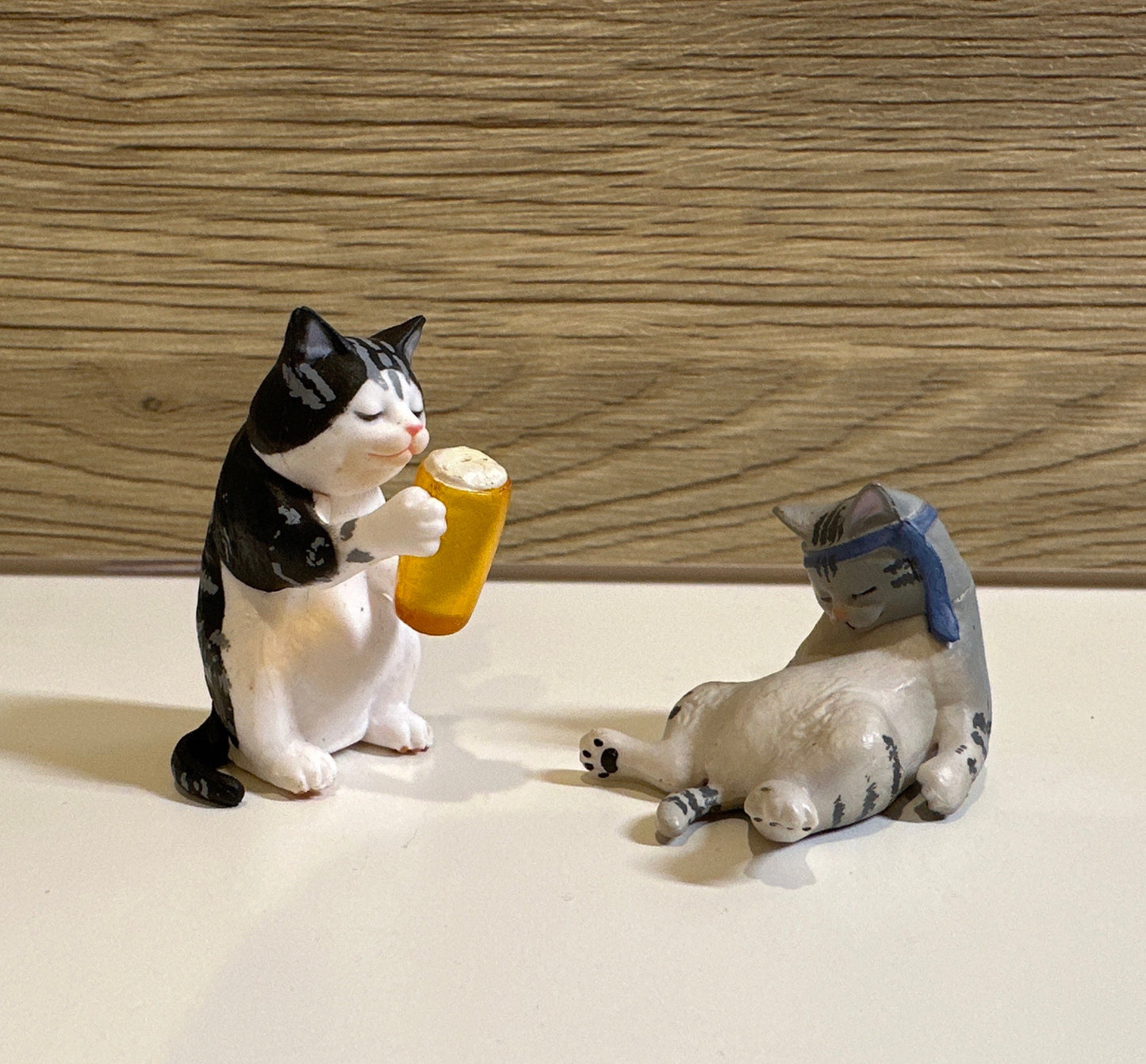 Drunk cat figurines