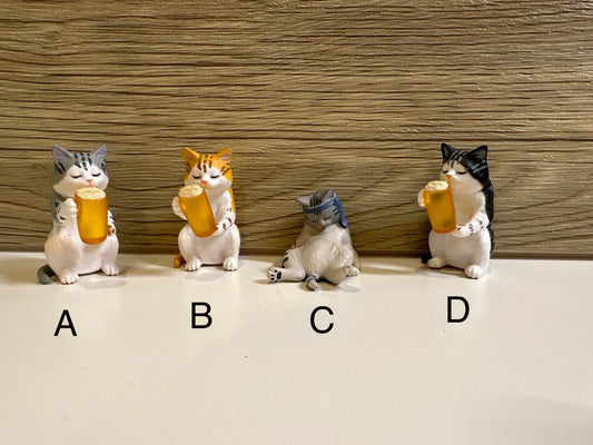 Drunk cat figurines