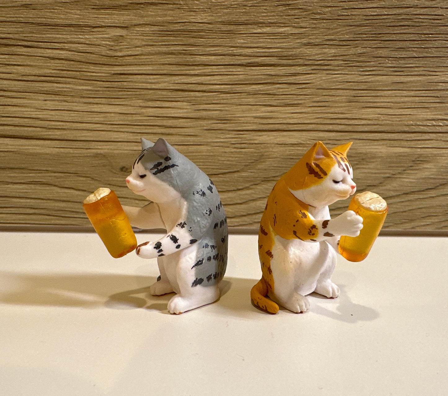 Drunk cat figurines